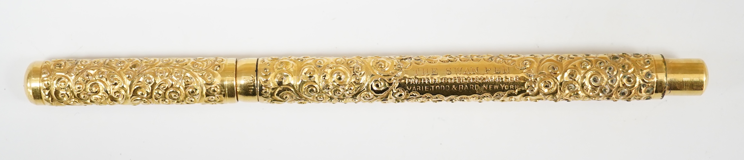 A Swan Mabie Todd & Bard Eyedropper in gold filled snail pattern, with over and under feed